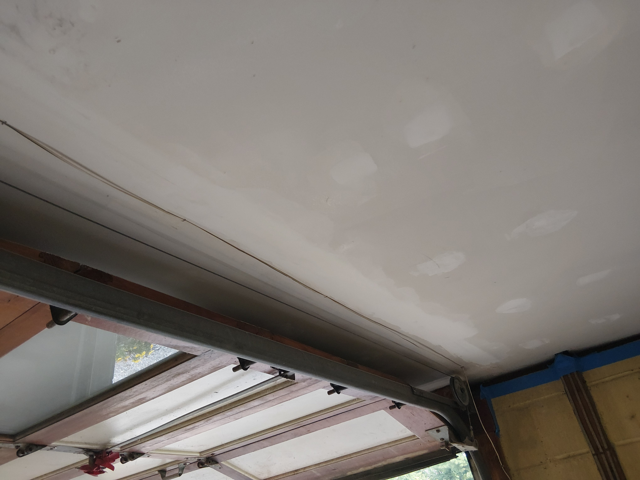 Repaired drywall seam compounded, feathered, and sanded smooth before primer and paint